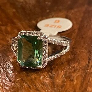 Green Apple lab created white topaz on a rhodium band.